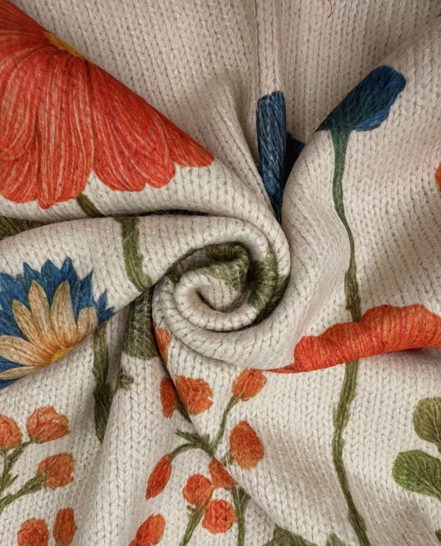 Ilaria | Cardigan con zip e motivo prato fiorito